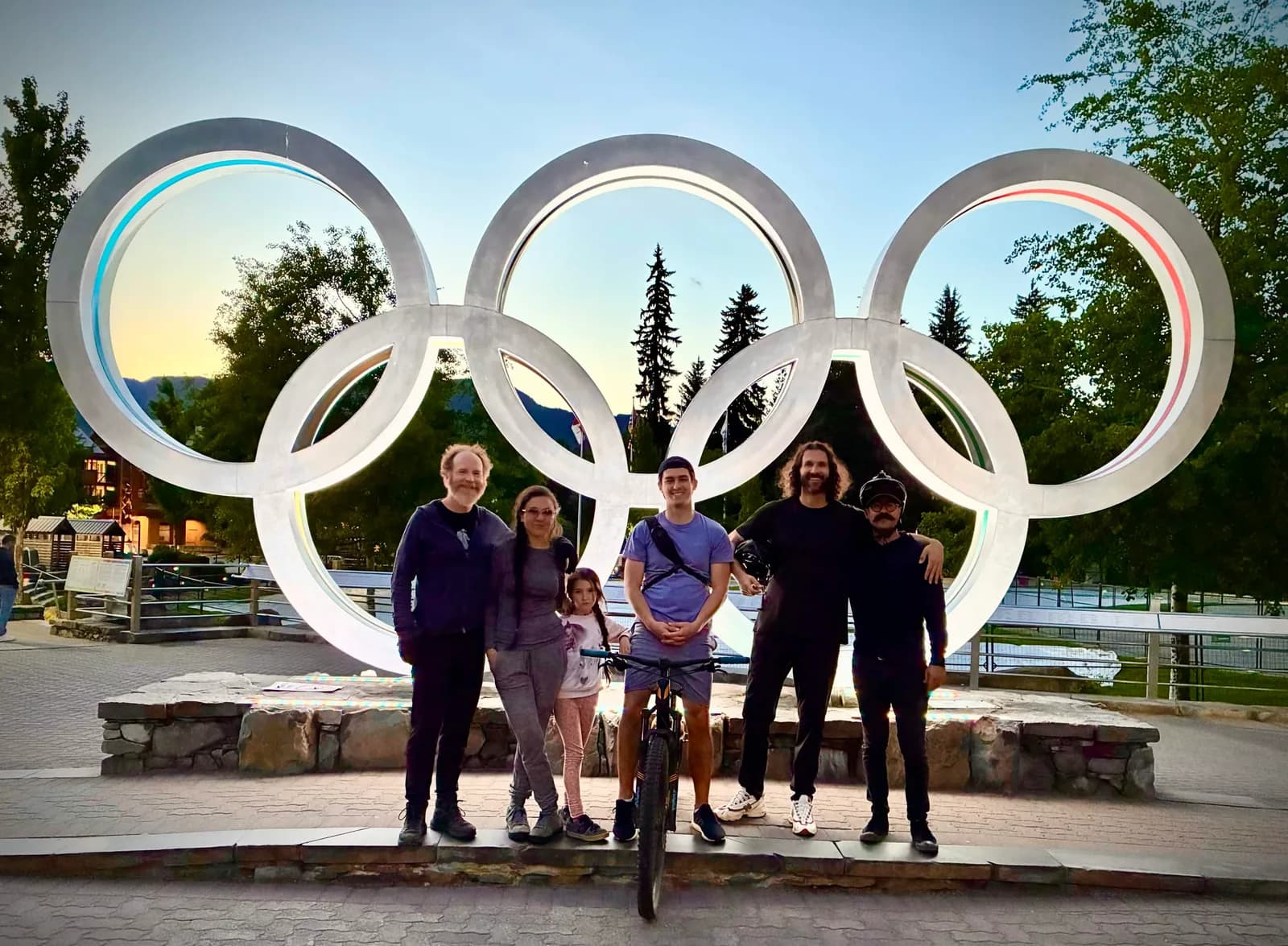 Soils.com team standing in front of large Olympic rings